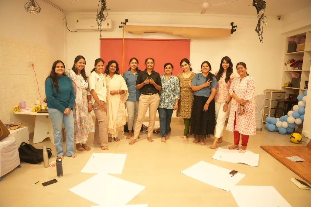 Mothers standing together at a The Motherhood Company gathering