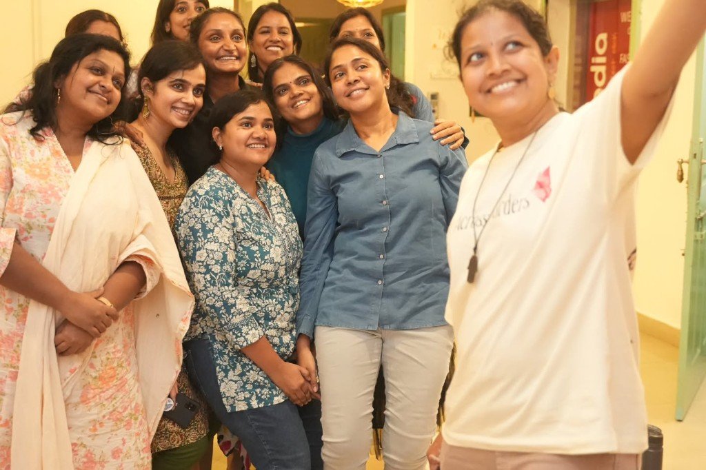 Mothers smiling together at a live class